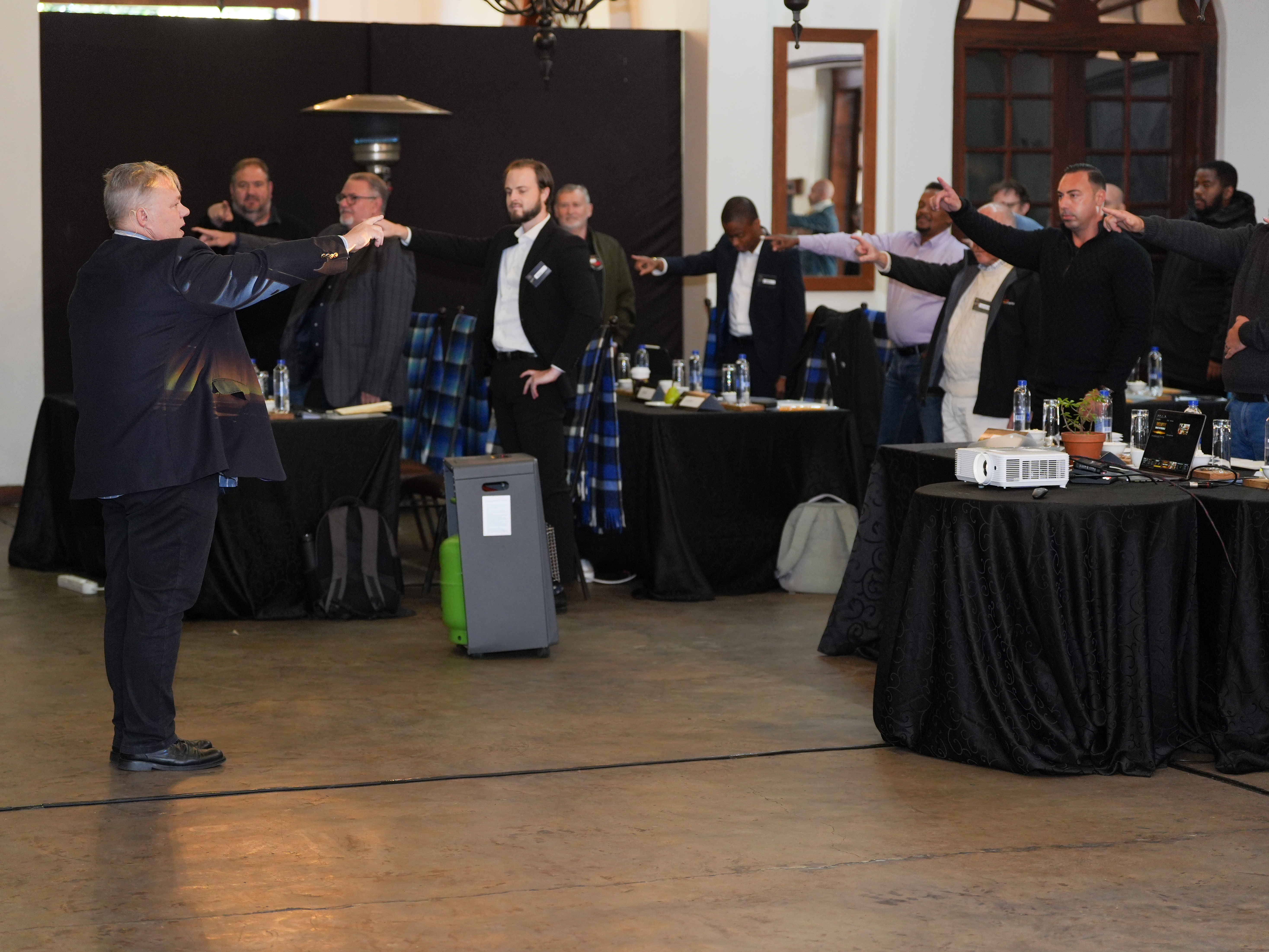 Barney Beukes on stage at a corporate speaking event